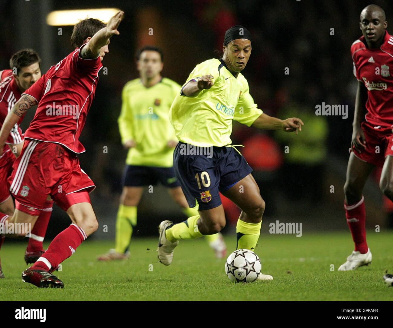 Soccer - UEFA Champions League - First Knockout Round - Second Leg - Liverpool v Barcelona - Anfield. Barcelona's Ronaldinho attempts to dribble his way through the Liverpool defence Stock Photo