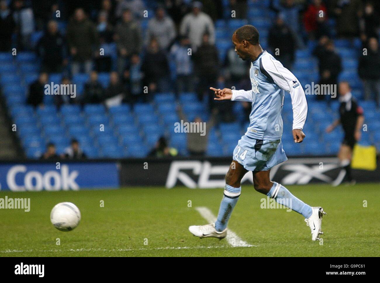 Manchester City's DaMarcus Beasley slots home his sides thrid goal of the match after rounding Southampton goalkeeper Kelvin Davis (not pictured) Stock Photo