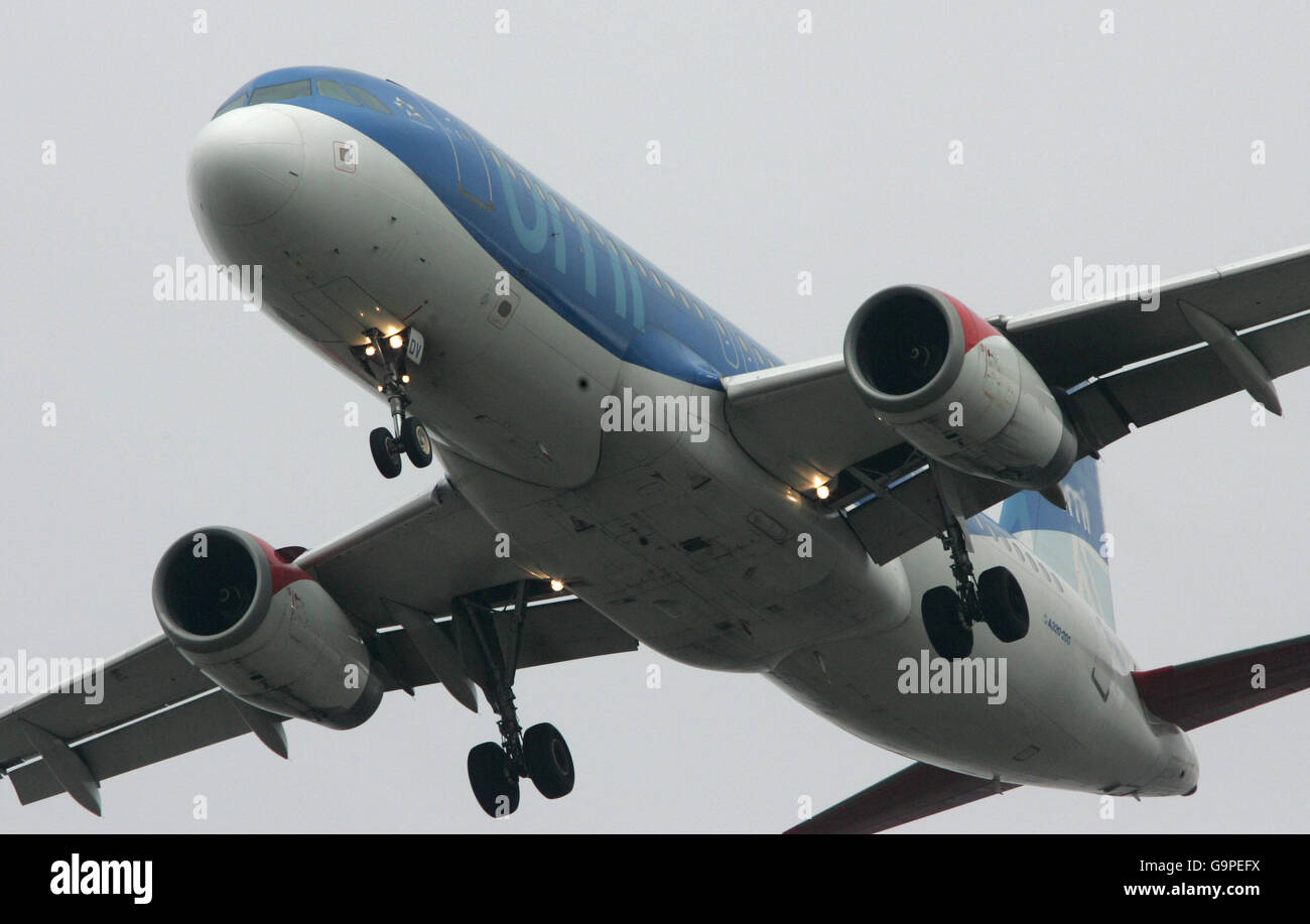 Generic transport pics. BMI British Midland Airbus arrives over the houses as it lands at London's Heathrow Airport. Stock Photo