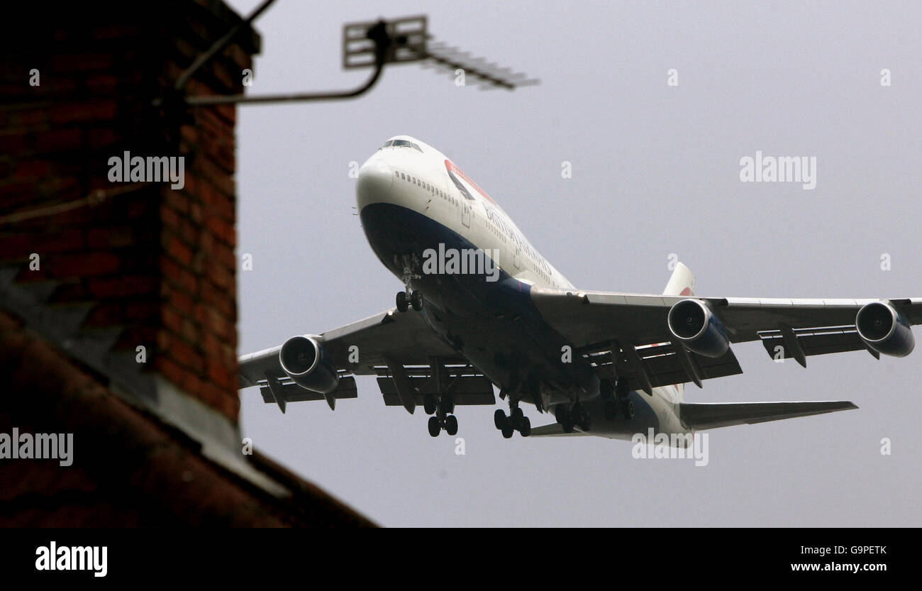 A British Airways Boeing 747 arrives over the houses as it lands at London's Heathrow Airport. Stock Photo