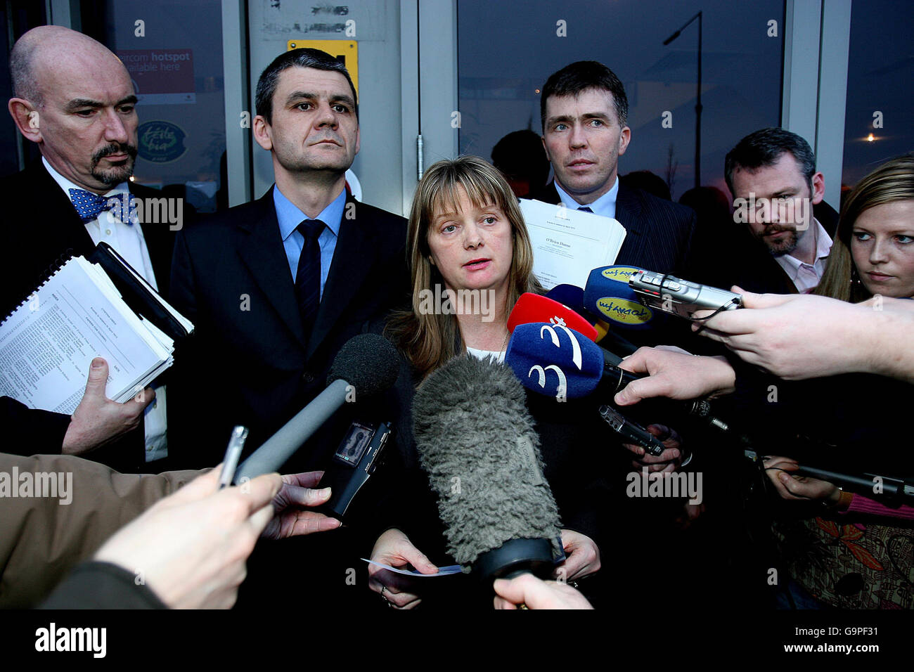 Cynthia Owen outside Dublin County Coroner's Court at the Plaza Hotel, Dublin, with her partner Simon Owen (second left), following an inquest into the death of a baby girl found dumped in a plastic bag in 1973 with 40 stab wounds. Stock Photo