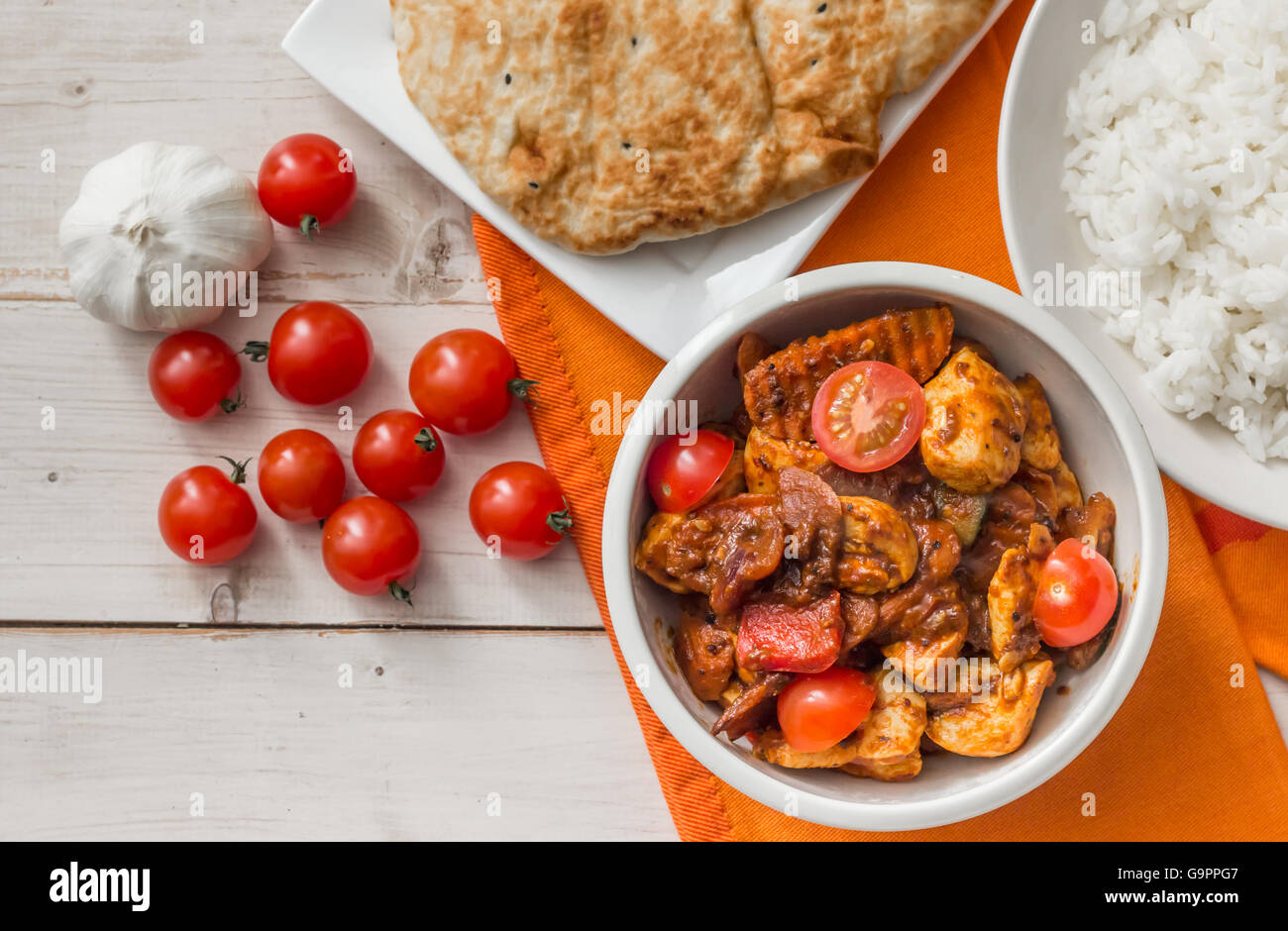 Indian chicken jalfrezi with basmati rice and naan bread Stock Photo