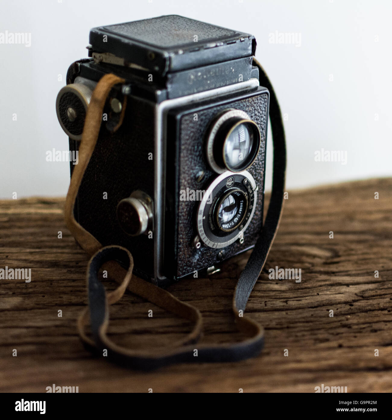 Old camera, Rolleiflex, with two lenses on old wooden shelf Stock Photo