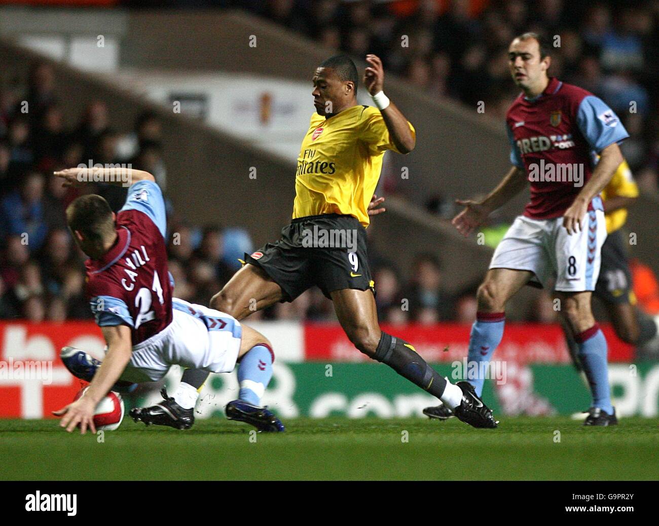 Soccer - FA Barclays Premiership - Aston Villa v Arsenal - Villa Park. Gary Cahill, Aston Villa (l) and Cesar Julio Baptista, Arsenal (c) battle for the ball Stock Photo