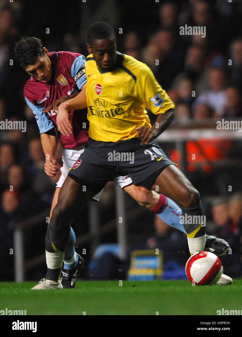 Soccer - FA Barclays Premiership - Aston Villa v Arsenal - Villa Park. Johan Djourou, Arsenal (r) and Gareth Barry, Aston Villa battle for the ball Stock Photo