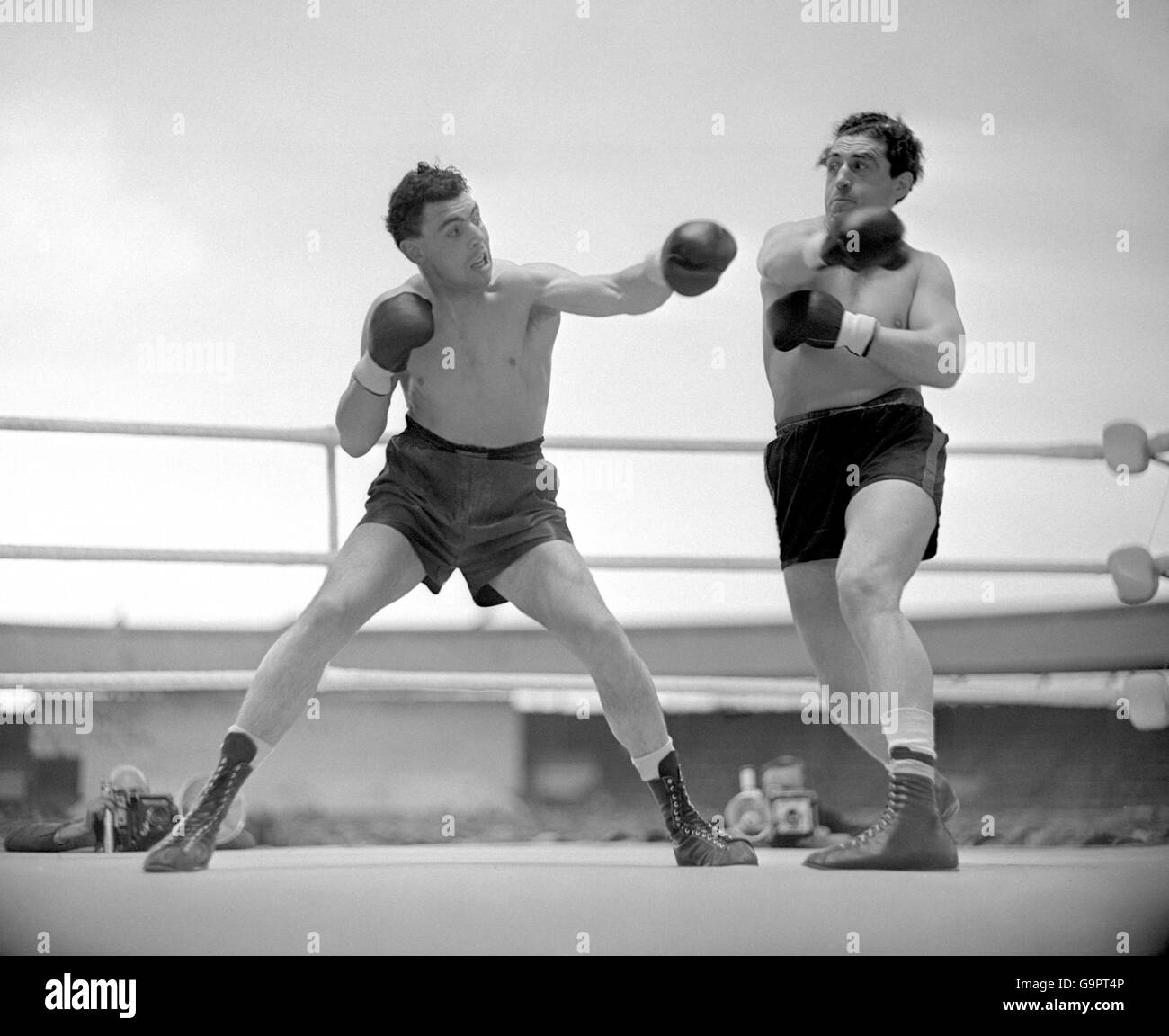 Boxing - Heavyweight Bout - Johnny Williams v Jo Weidin - White City. Johnny Williams (l) and Jo Weidin (r) swing and miss each other Stock Photo