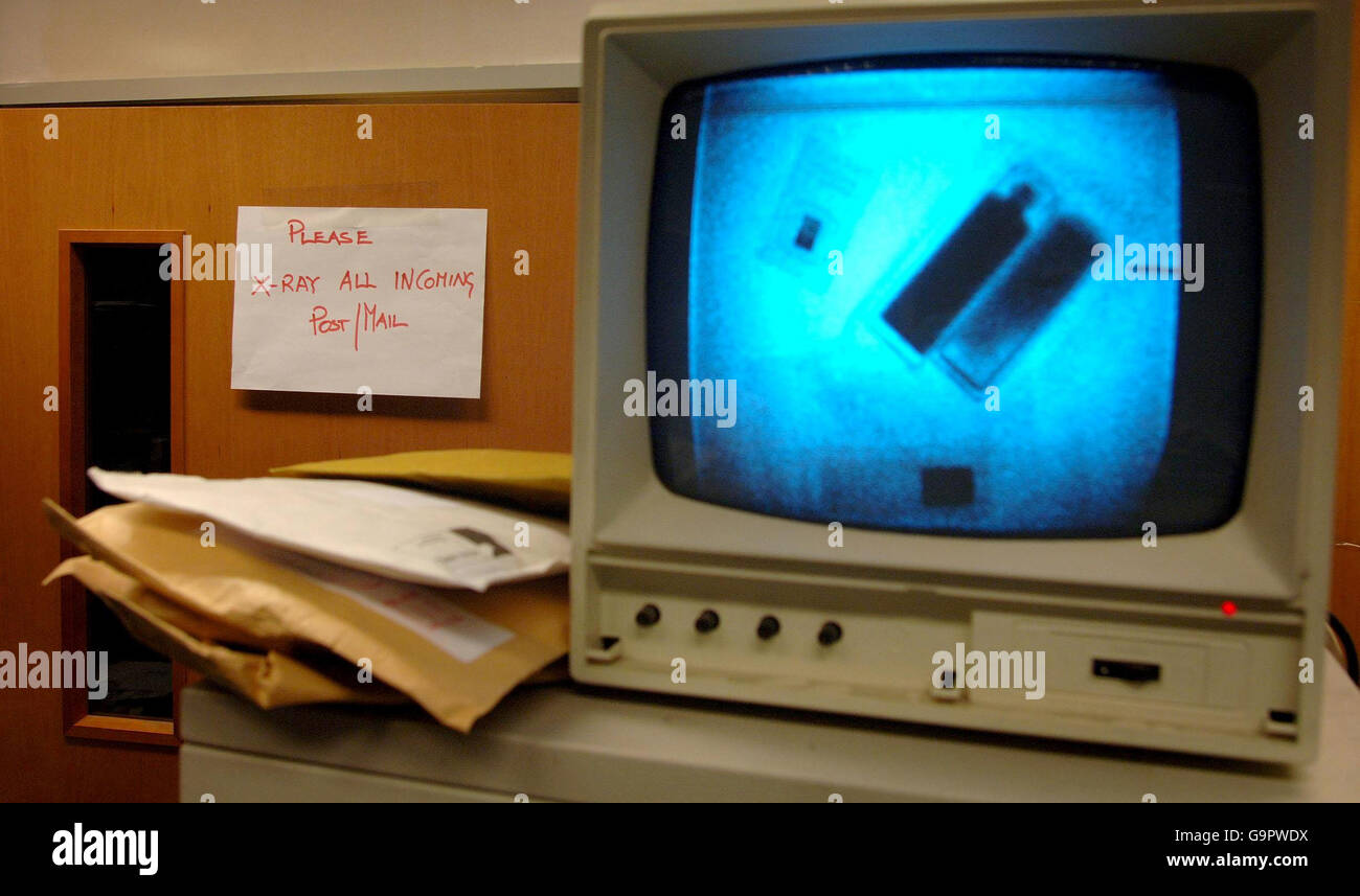 View of a sign asking employees to XRay post and parcels, next to a