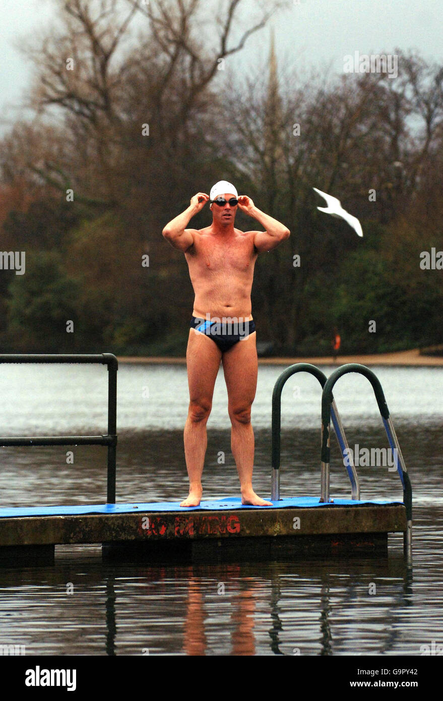Lewis Gordon Pugh, an endurance swimmer and environmental campaigner undertakes a training swim in the Serpentine in London's Hyde Park today. Stock Photo