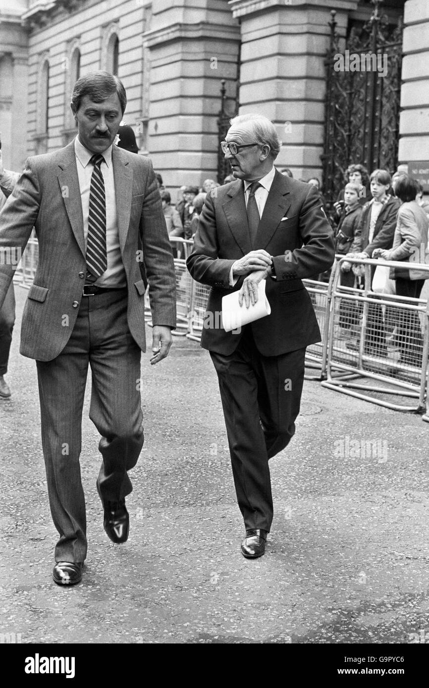 Foreign Secretary Lord Carrington checks his watch as he left 10 Downing Street after an emergency Cabinet meeting to discuss the Falkland Islands dispute. Stock Photo
