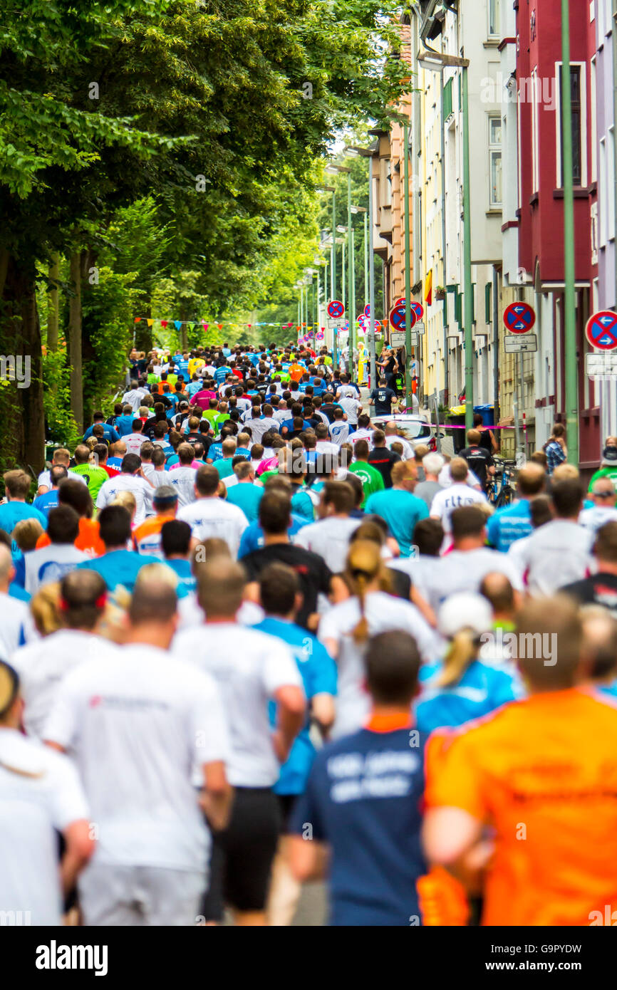 Annual company city run, with over 10000 participants, a 5 Kilometer run for company teams through the city of Essen, Germany Stock Photo