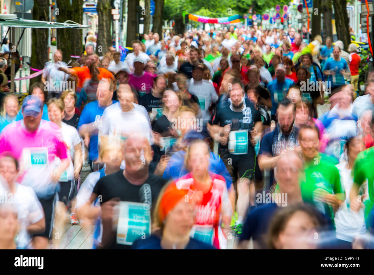 Annual company city run, with over 10000 participants, a 5 Kilometer run for company teams through the city of Essen, Germany Stock Photo