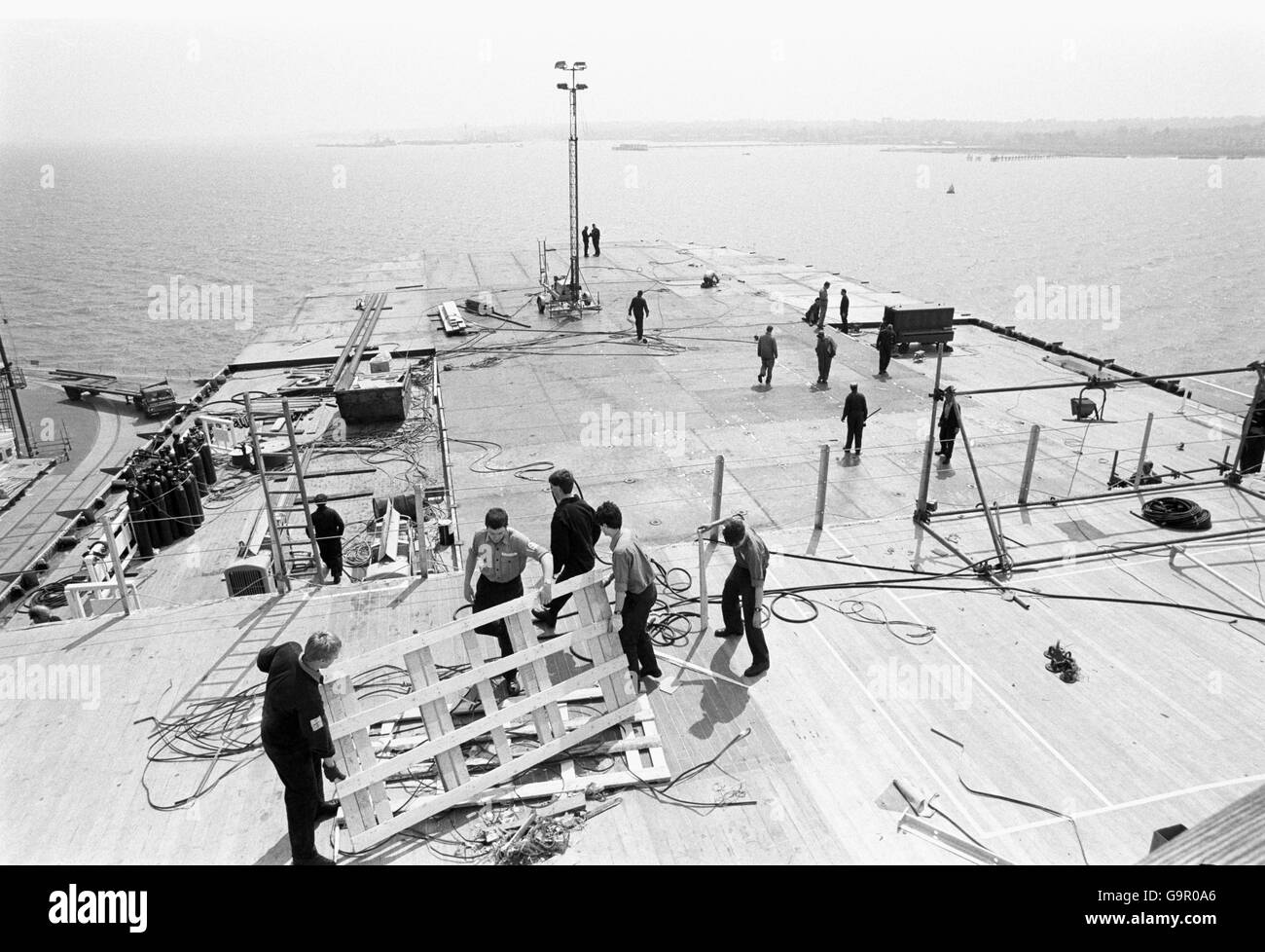 Work being carried out on the deck of the QE2 to convert it into a