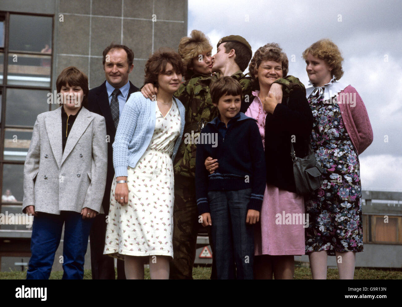 Scots guardsman Philip williams, 18, with his family after he arrived home from the Falklands with the rest of the regiment at Brize Norton today. (L-R) Sister Angela, father Alan, sister Karen, girlfriend Alison Boow, 21, Guardsman Williams, brother Gareth, mother Rosemary and sister Cherith. the family travelled down from Halton, Lancashire, to welcome back Guardsman Williams, who was missing, presumed dead on the Falkands for seven weeks. Stock Photo
