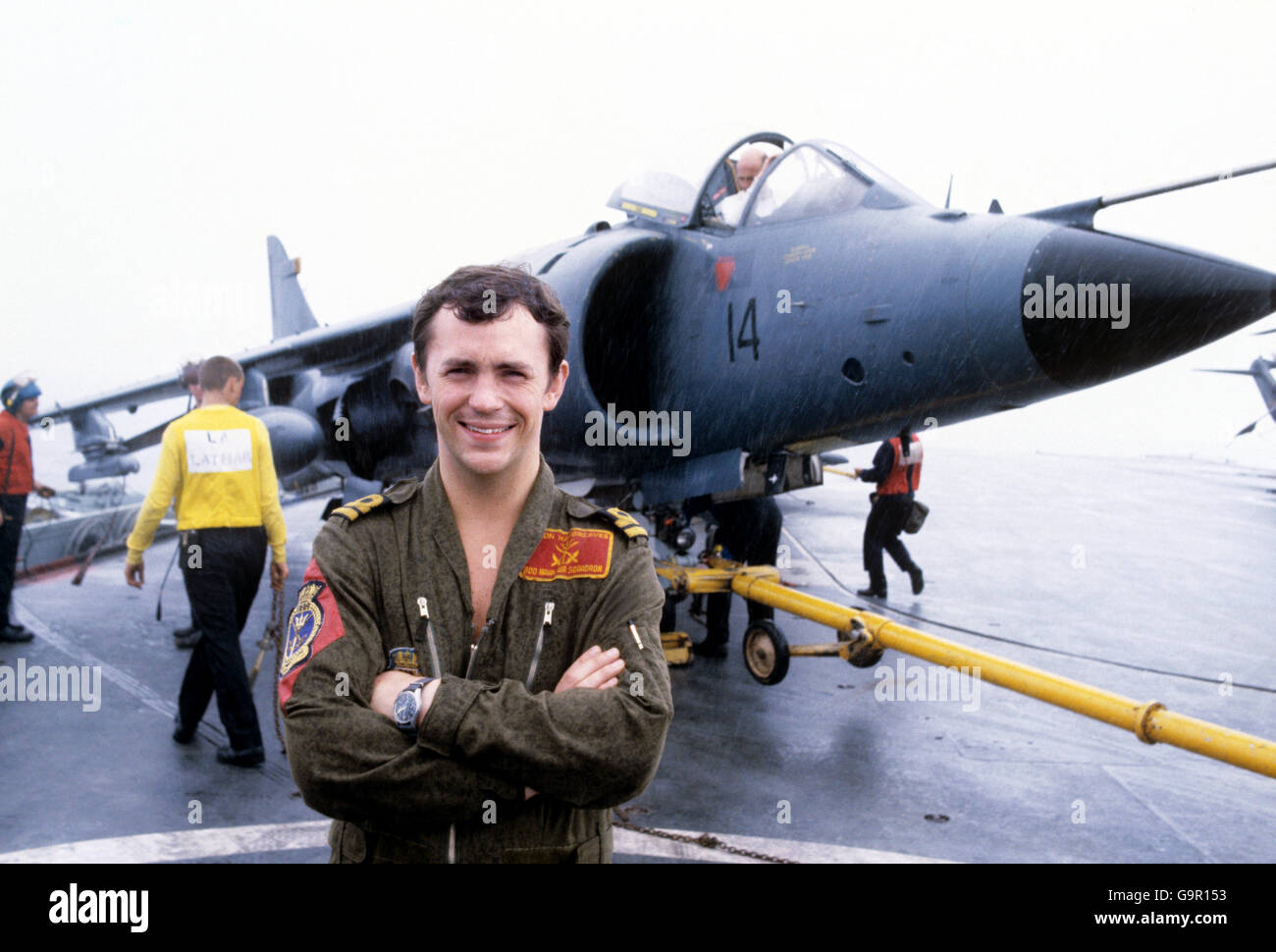 Lieutenant simon Hargreaves, 25, from Bower Hinton, Somerset, standing in front of his Sea Harrier on flight deck of HMS Hermes after returning to the carrier after intercepting an Argentinian military 707 aircraft - the first sighting of the enemy. Stock Photo