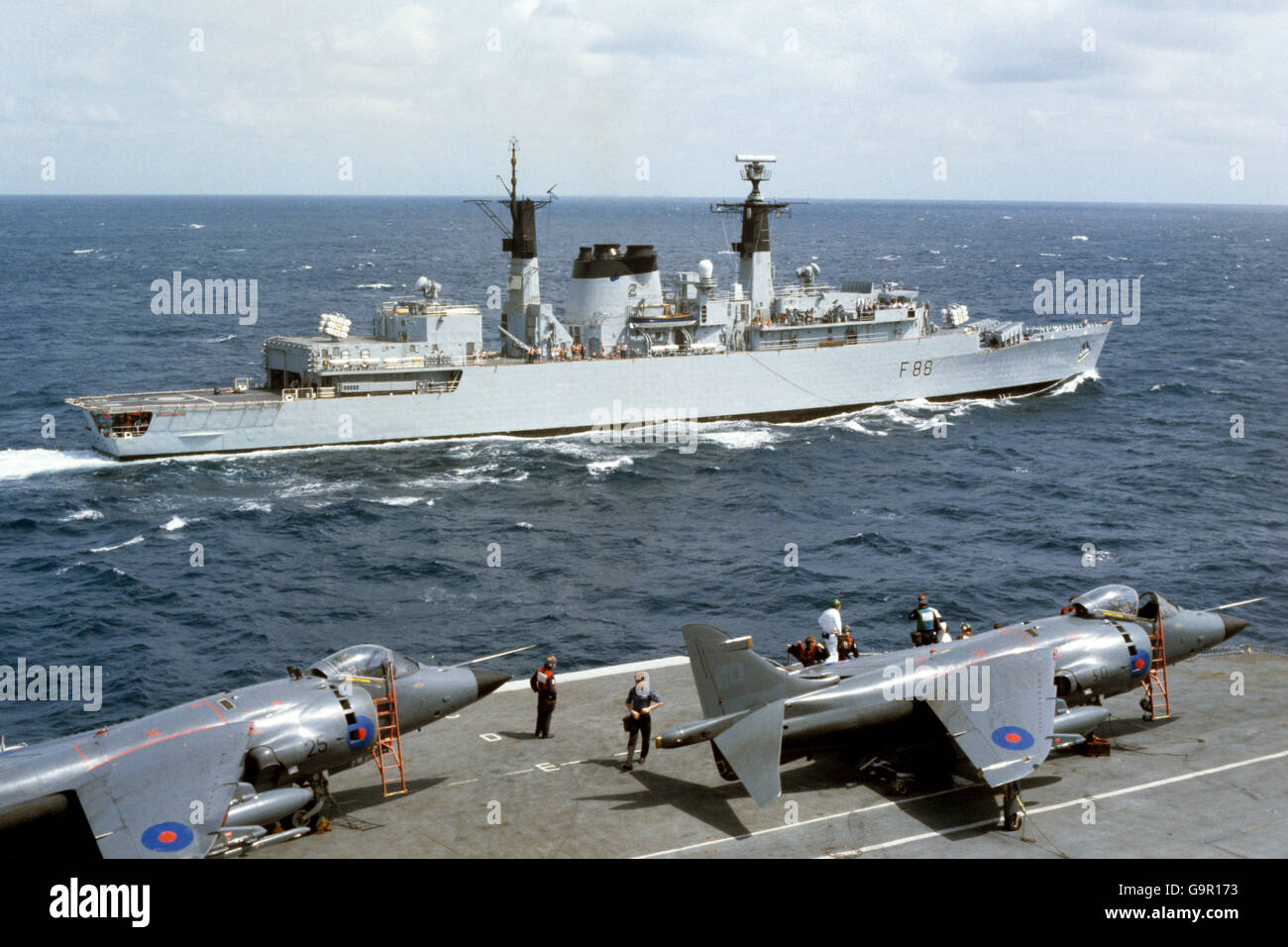 Sea Harriers parked in readiness on the flight deck of HMS Hermes as she and the rest of the task force sail south to the Falkland Islands. Stock Photo