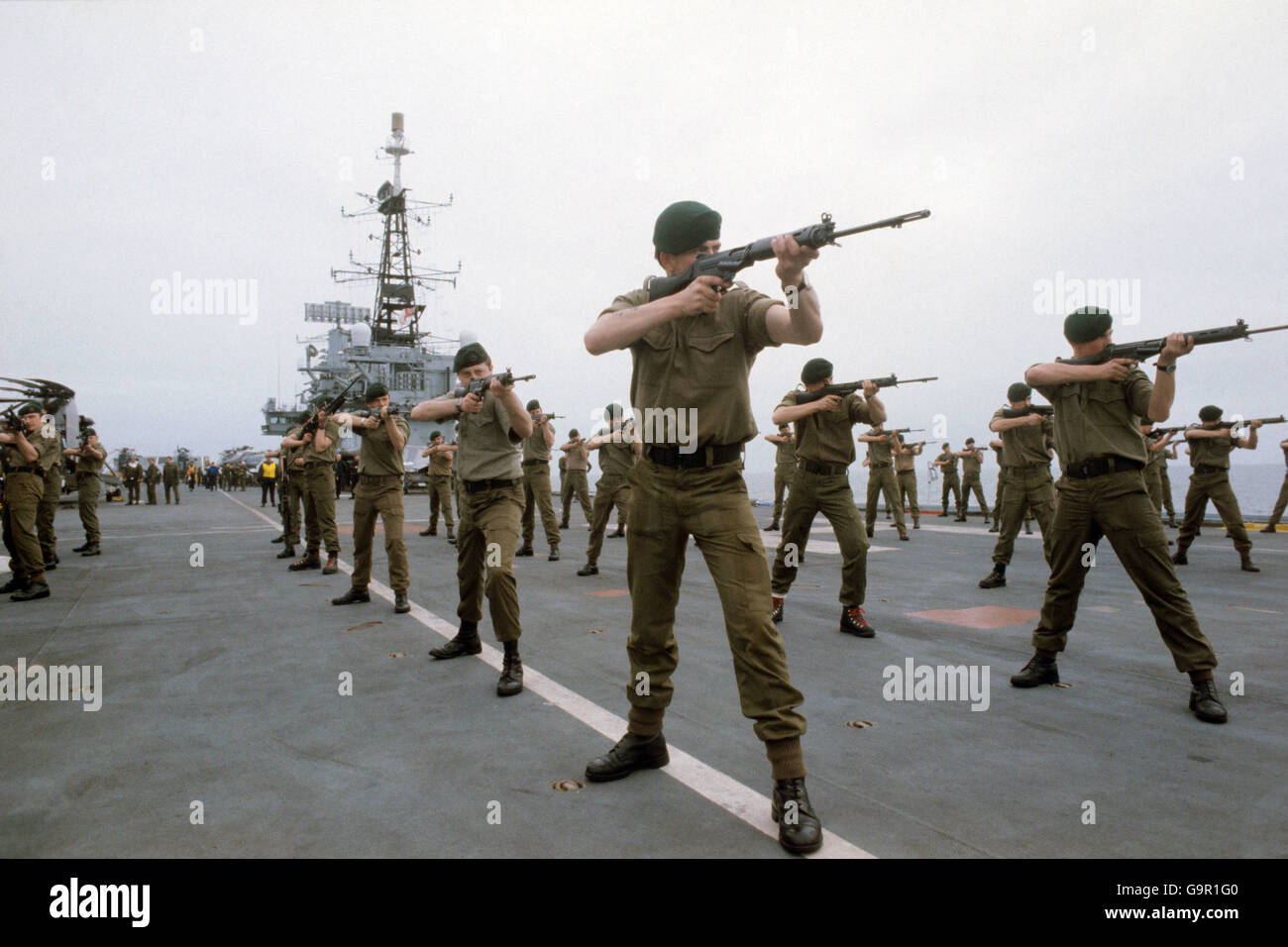 Royal Marines exercise on deck of HMS Hermes, the Flag Ship of the British Task Force on route for the Falkland Islands. Stock Photo