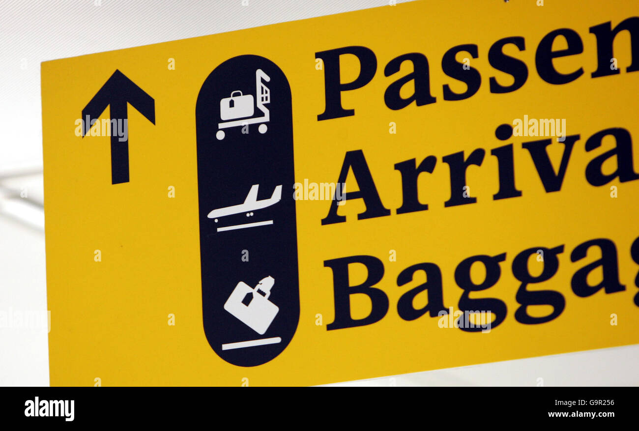 Signs in the arrivals area of Terminal Three of London's Heathrow Airport. Stock Photo