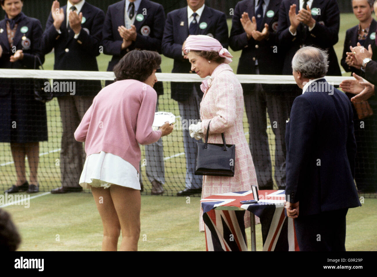 The Queen talking to Britain's Virginia Wade after presenting her with the trophy as Women's Singles Champion. Wade beat Betty Stove of the Netherlands 4-6 6-3 6-1. Stock Photo