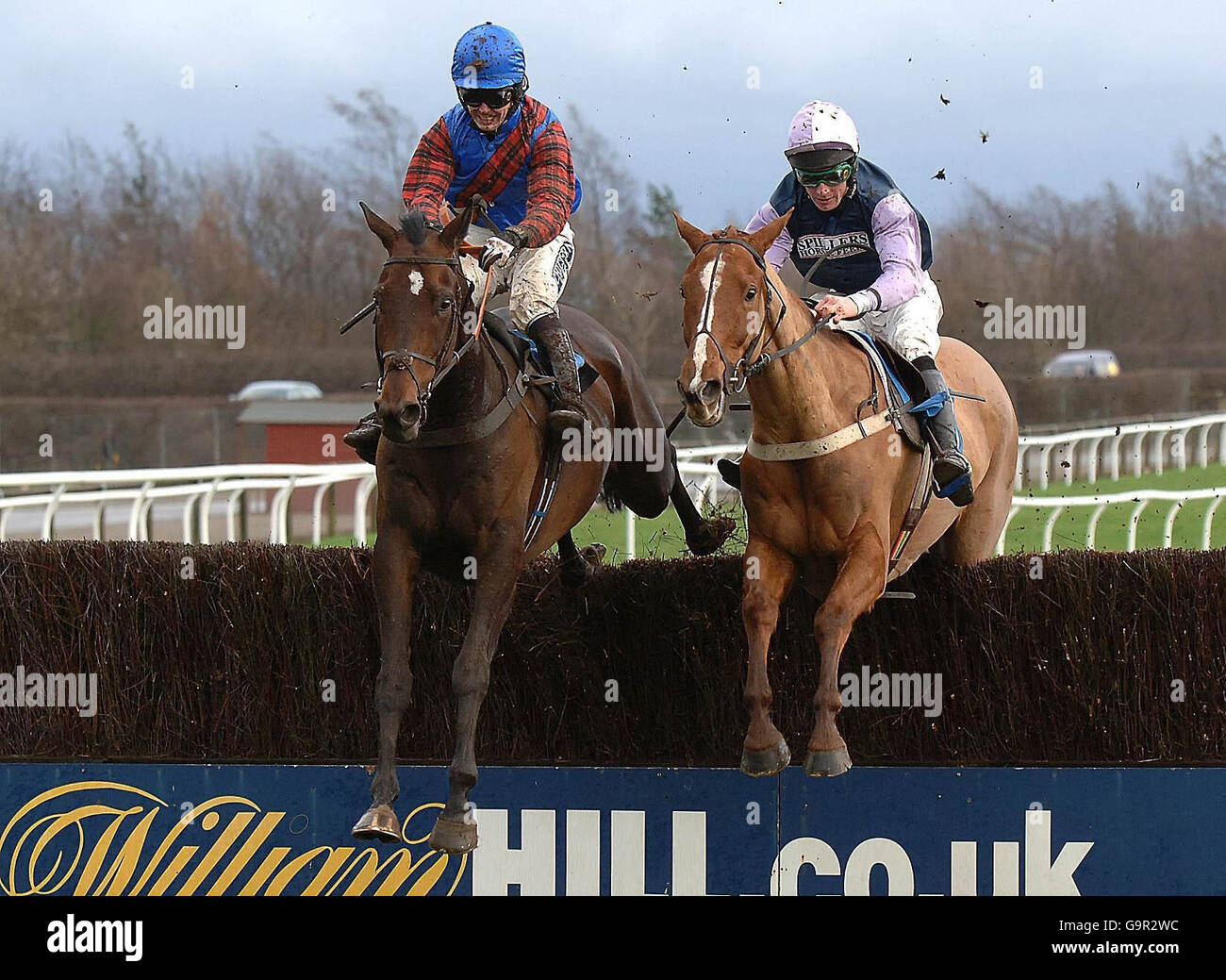 Marshall Hall ridden by Graham Lee (left) move ahead of Flight Command ridden by Richard McGrath to win the Watt Fences Racecourse Suppliers Chase at Catterick Racecourse. Stock Photo