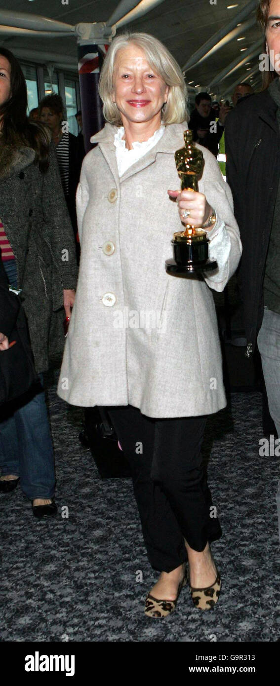 Dame Helen Mirren returns to UK. Dame Helen Mirren arrives back at Heathrow Airport, after winning Best Actress at Sunday night's Oscars. Stock Photo
