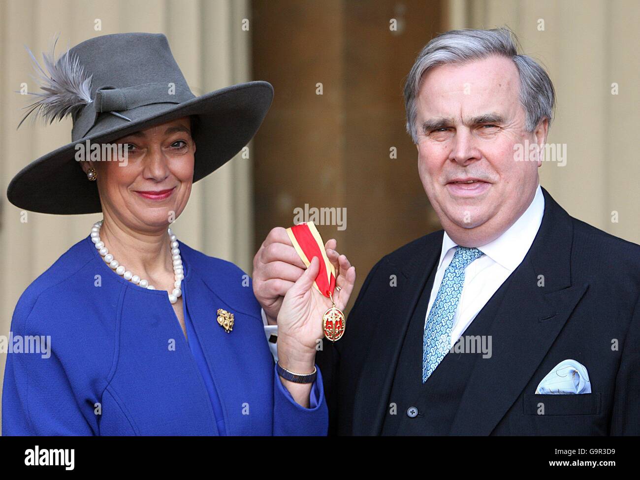 Sir David Brewer with his wife Tessa receives a Knighthood at