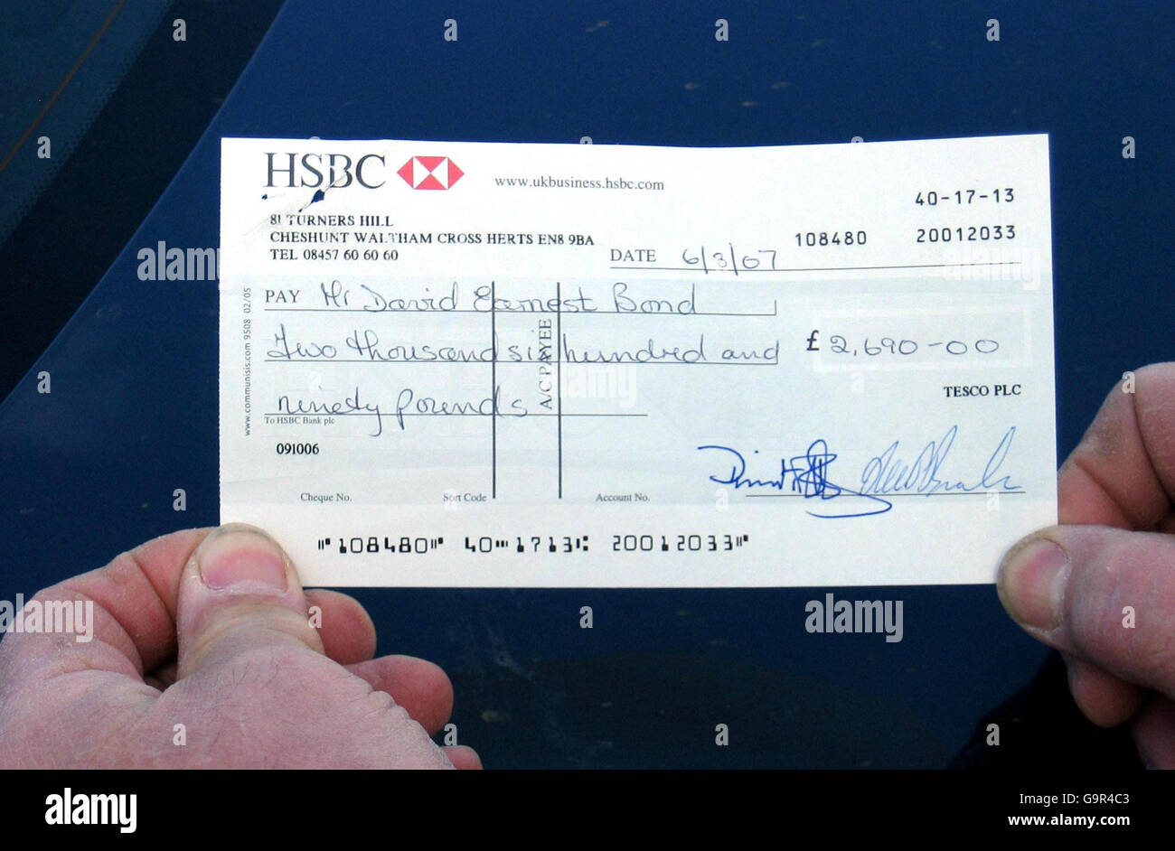 A cheque from Tesco made payable to van driver David Bond, after the supermarket giant complied with a High Court order and paid him damages - thanks to a recent visit from the bailiffs. Stock Photo