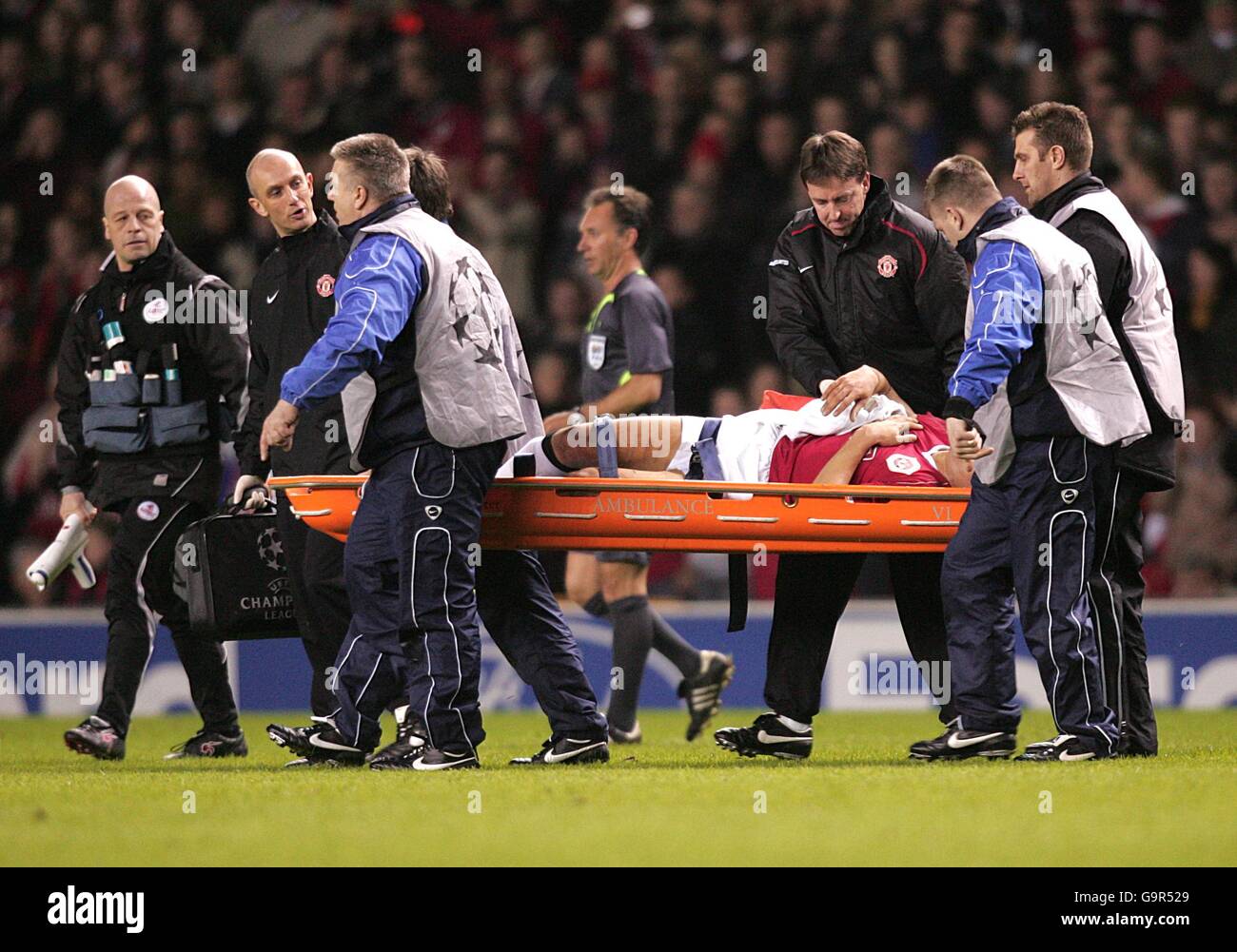 Full length serious injury stretcher football hires stock photography