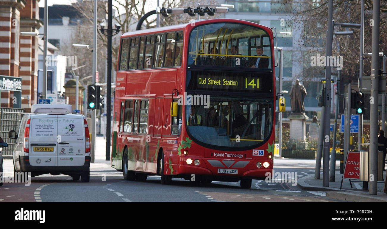 The world's first hybrid diesel electric double decker bus pulls out in  front of a van to start transporting for London's first hybrid bus line, route  141 Stock Photo - Alamy