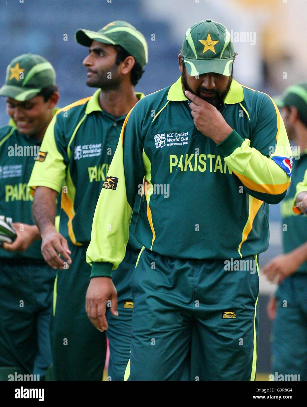 Pakistan captain InzamamulHaq (right) leaves the field after victory against Zimbabwe in the
