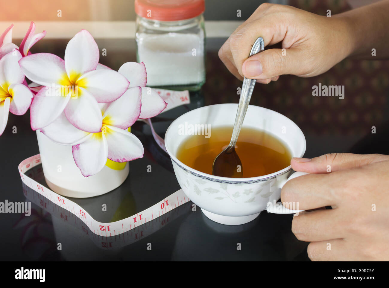 Hands With Cup Of Tea And Background Of Tape Measures And Sugar Diet Or Weight Loss Tea Cup Of Laxative Tea And Girl Or Women Stock Photo Alamy Hands With Cup Of Tea And Background Of Tape Measures And Sugar Diet Or Weight Loss Tea Cup Of Laxative Tea And Girl Or Women Stock Photo Alamy