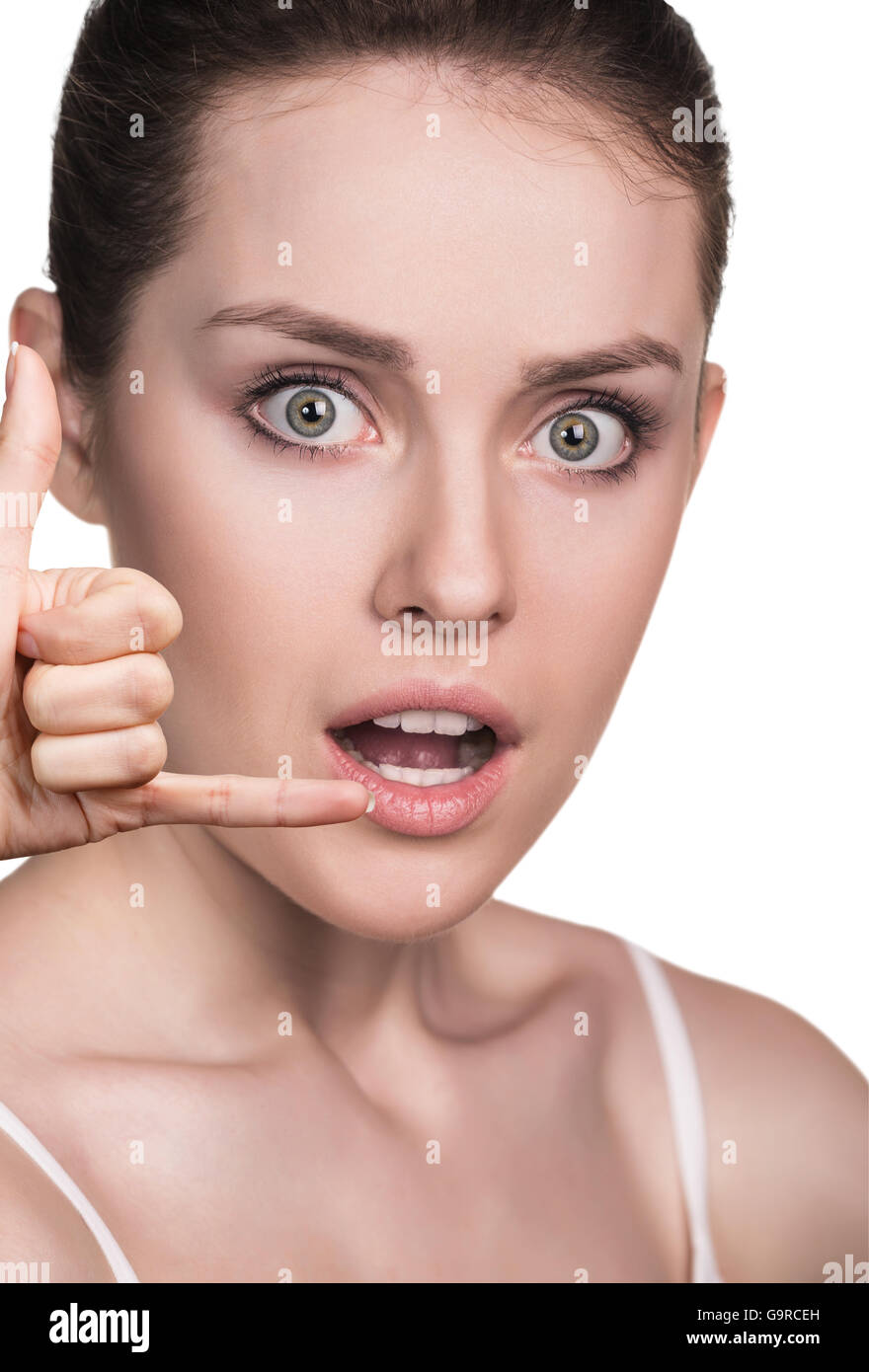 Beautiful young woman making a call me gesture Stock Photo