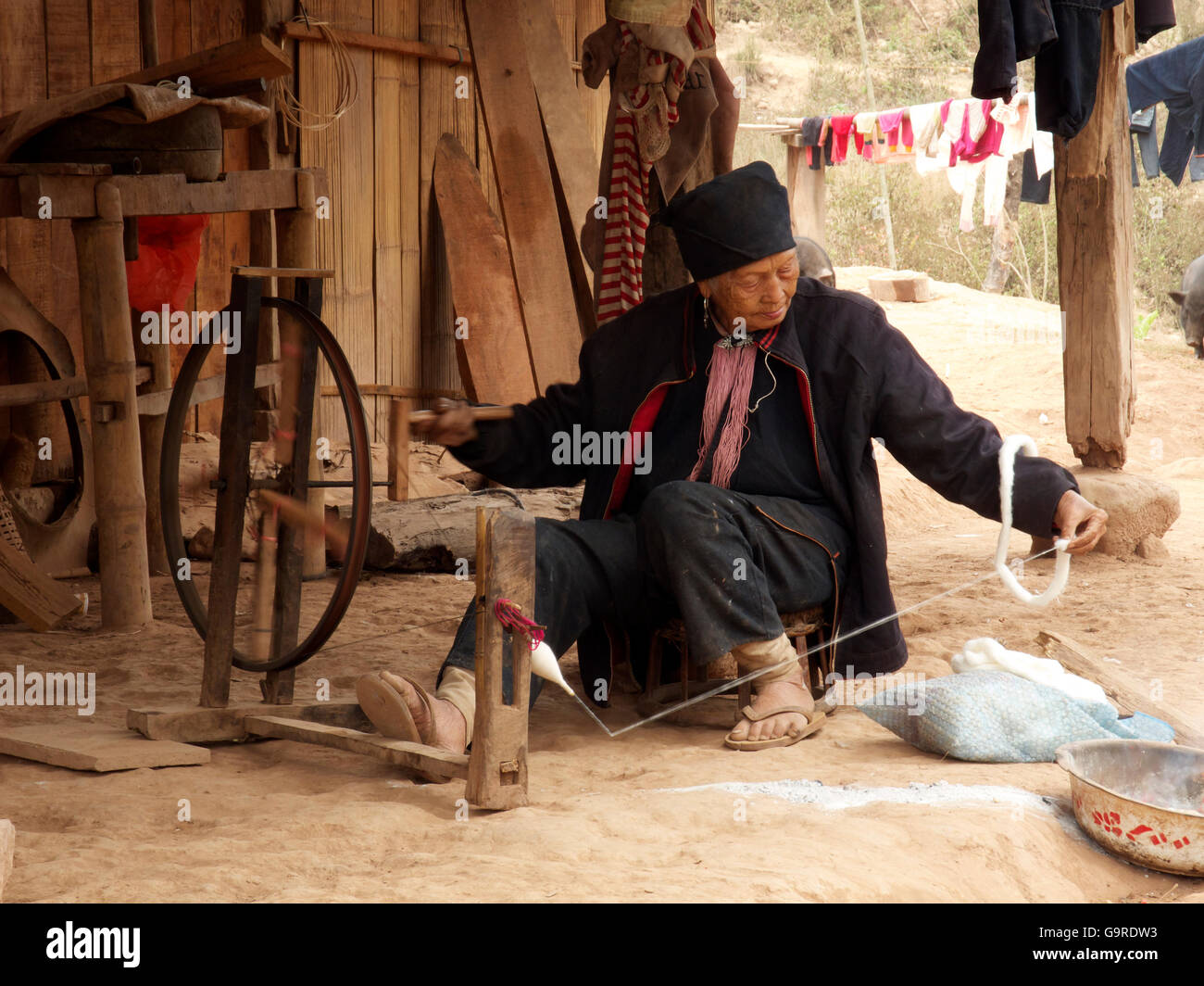 old woman with spinning wheel, Ou Tai, province Oudomxay, Laos, Asia / Ou Tai Stock Photo