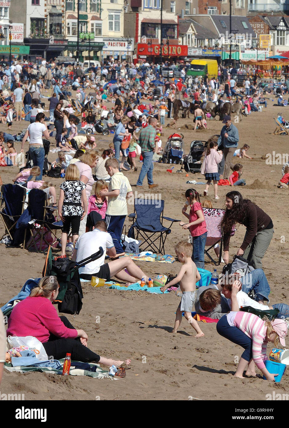 People enjoy the warm weather on Scarborough beach over the Easter bank holiday weekend. Stock Photo