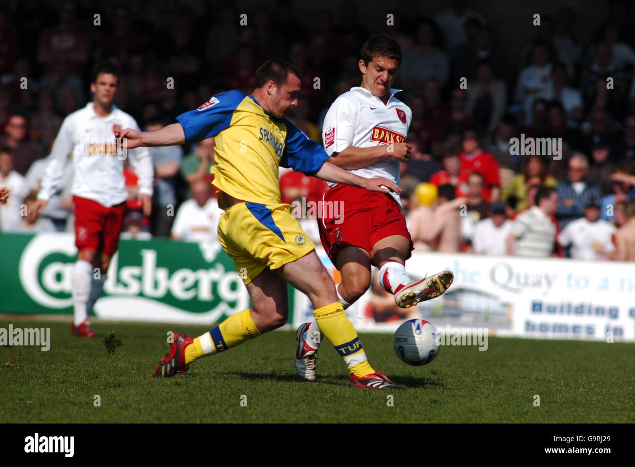 Torquay United's Matt Hockley and Walsall's Kris Taylor during the Coca-Cola Football League Two match at the Plainmoor ground, Torquay. Stock Photo
