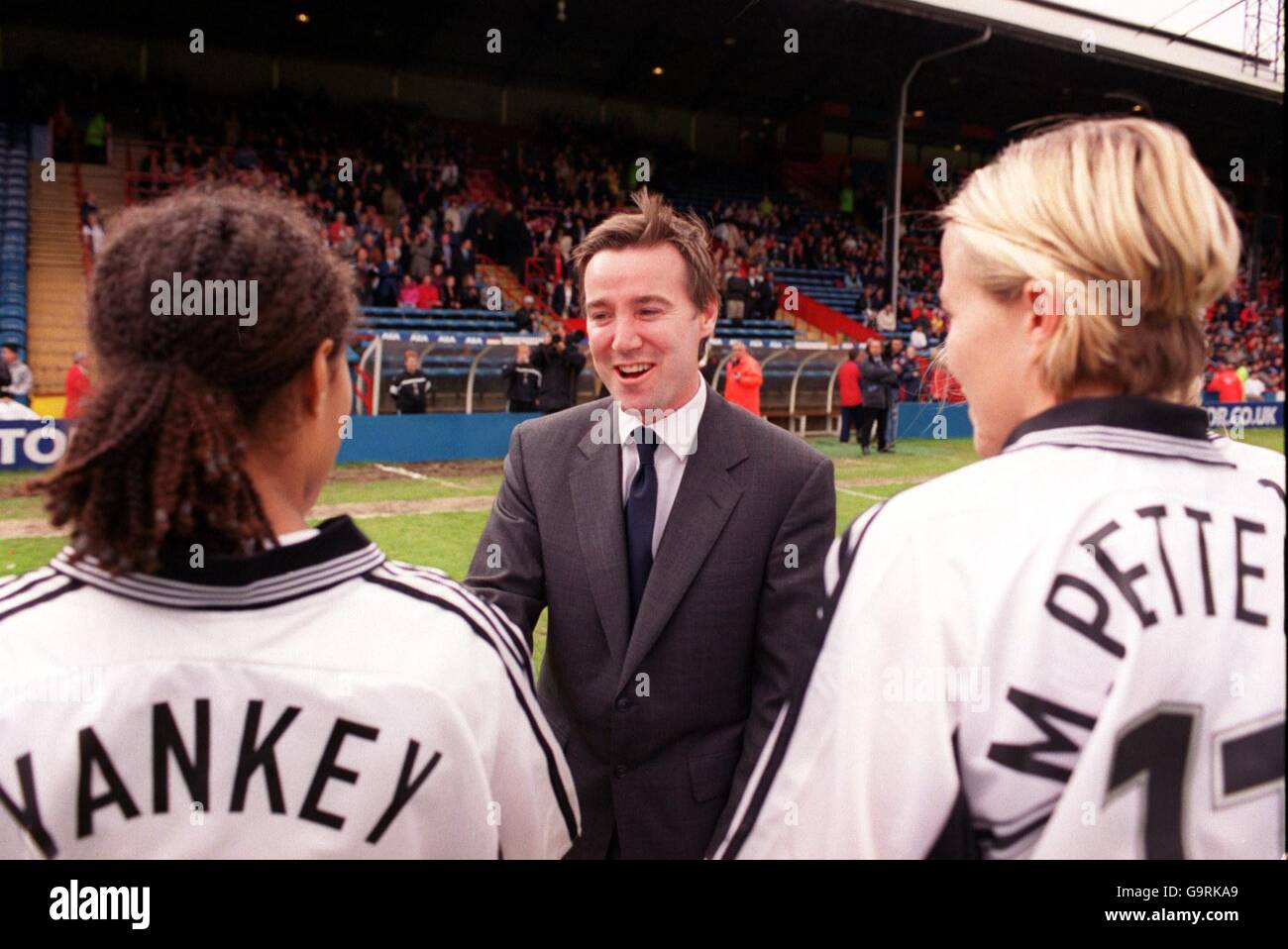 Women's Soccer - AXA FA Cup Final - Arsenal v Fulham. FA Chief Executive Adam Crozier (c) is introduced to Fulham's Rachel Yankey (l) as teammate Marianne Pettersen (r) looks on Stock Photo