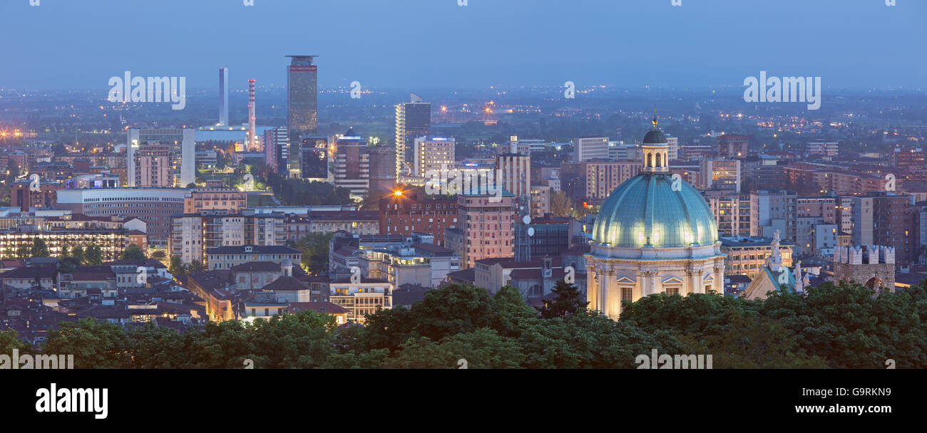BRESCIA, ITALY - MAY 21, 2016: The panorama of Brescia with the cupola of Duomo at dusk. Stock Photo