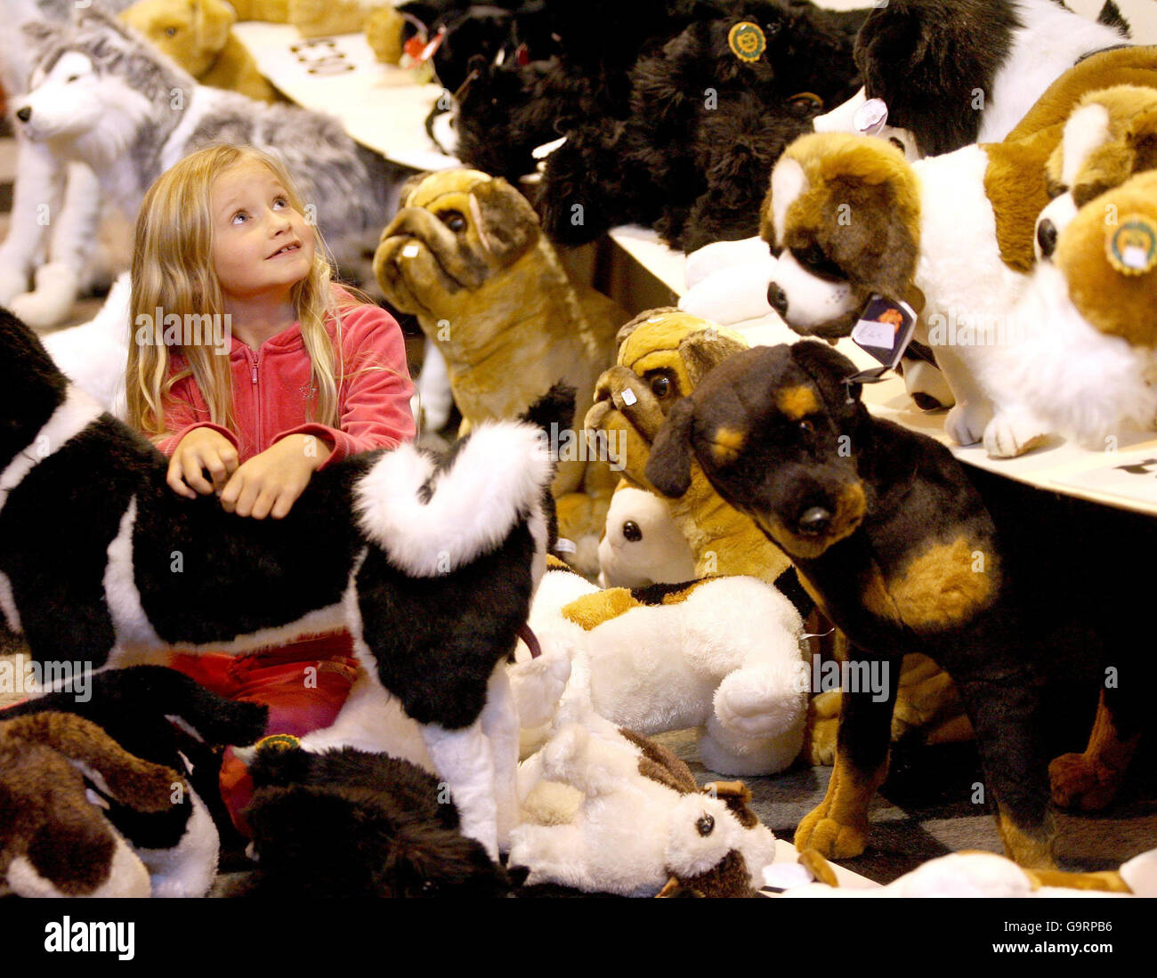 Grace Waddington, from Herefordshire, chooses a toy dog as a gift for her eighth birthday tomorrow during Crufts 2007 at the NEC in Birmingham. Stock Photo