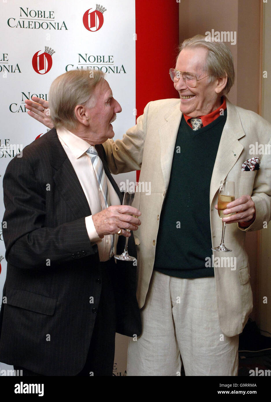Peter O'Toole (right) congratulates Leslie Phillips on winning the 'Trouper of the Year Award', at The Oldie Magazine's 'Oldie of the Year Awards' in Simpsons hotel, central London. Stock Photo