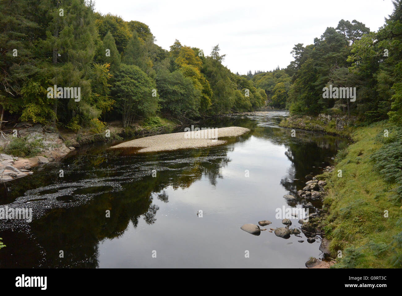 Dark water of the Findhorn river in Scotland Stock Photo