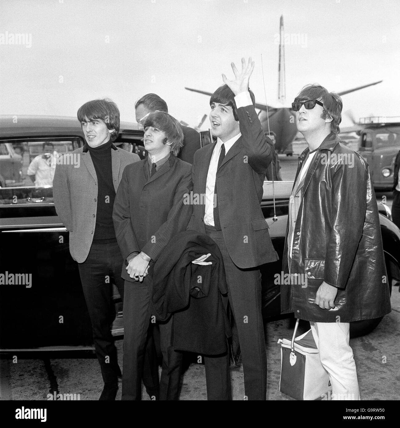 A wave for the fans seeing them off as the Beatles were about to board a BEA Liner for Stockholm Stock Photo