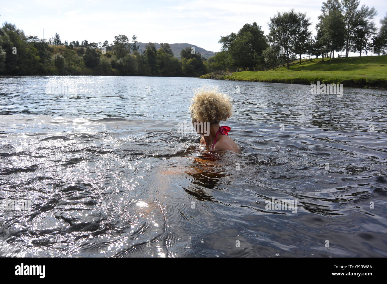 Wild swimming in the river Spey Stock Photo