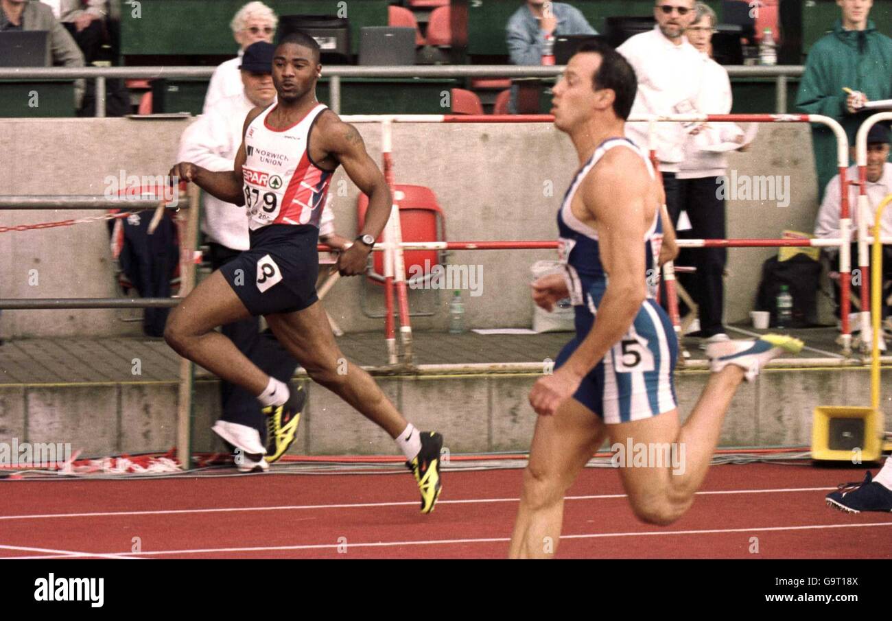Mark Lewis-Francis looks across to check who has come second in the ...