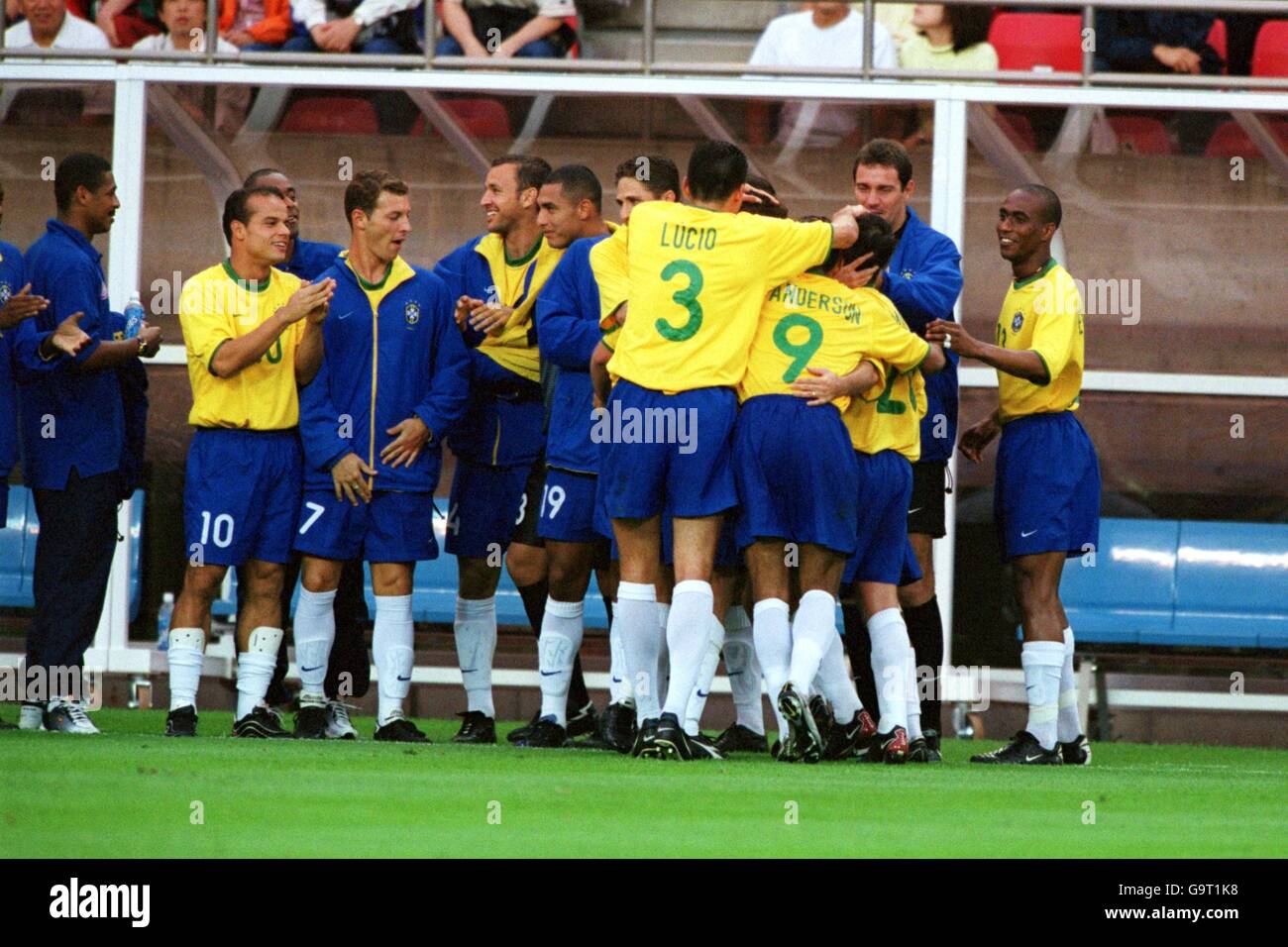 Soccer - FIFA Confederations Cup - Group B - Brazil v Cameroon. Brazil's Carlos Miguel (hidden) is swamped by teammates after scoring the second goal Stock Photo