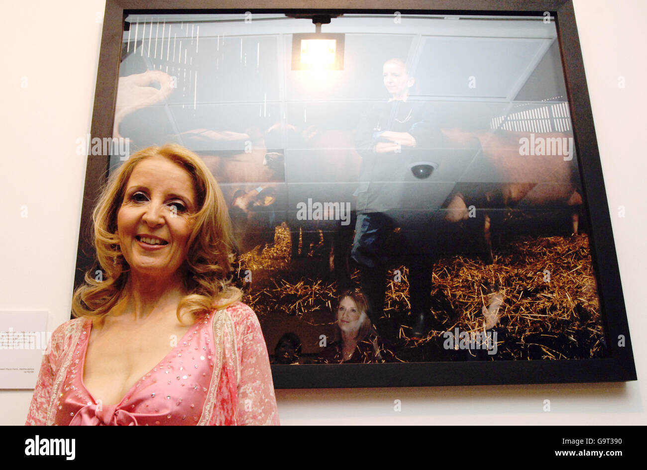 Gillian McKeith stands next to her portrait depicting her childhood dream of 'being a vet', at the 'When I Grow Up' photographic exhibition - held by the Children's Society - in central London. Stock Photo