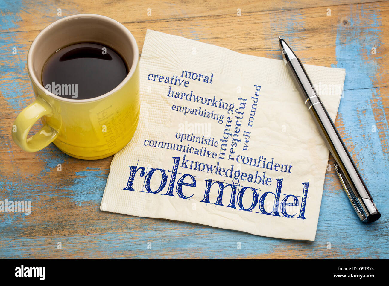 role model qualities word cloud -handwriting on a napkin with a cup of coffee Stock Photo