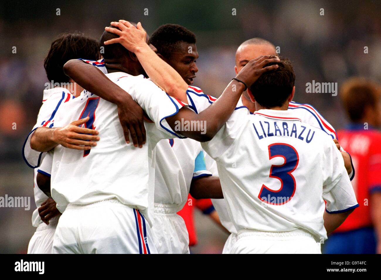 France's Patrick Vieira is congratulated by his teammates after scoring the second goal Stock Photo