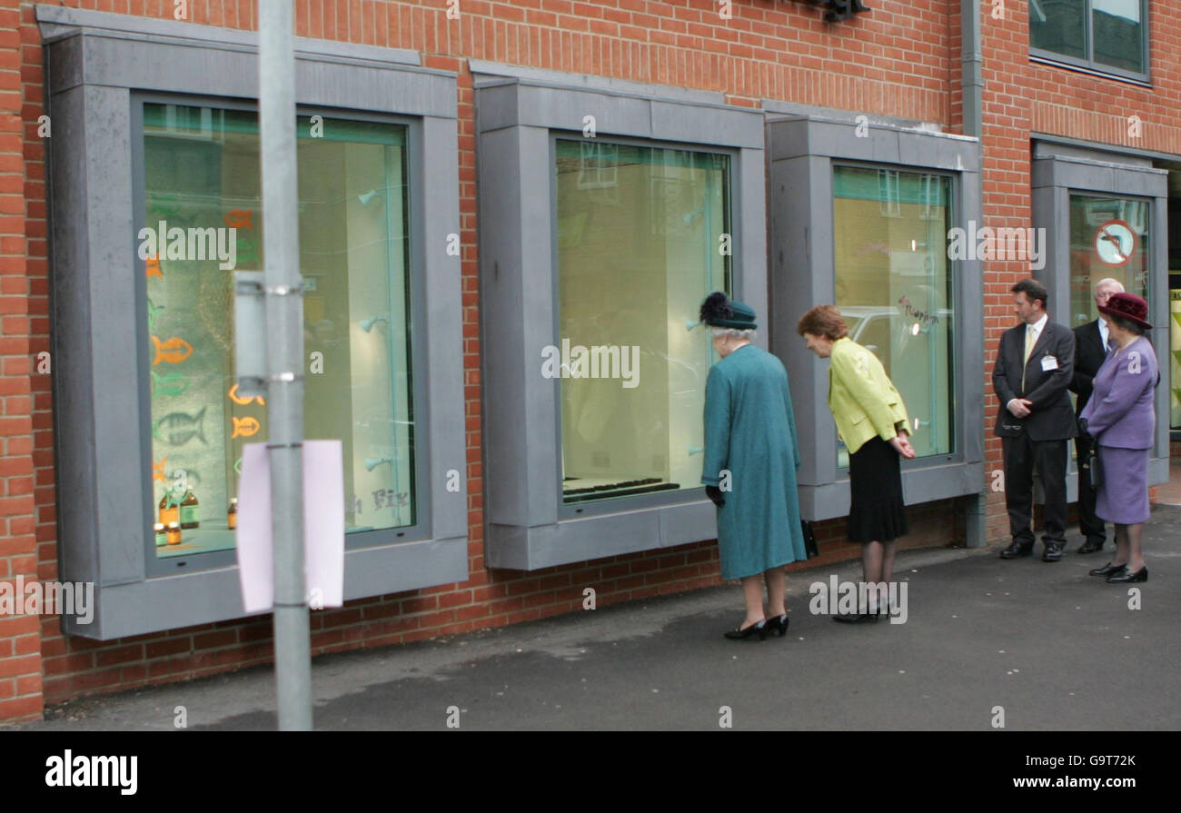 Britain's Queen Elizabeth II looks at 'window displays', part of a