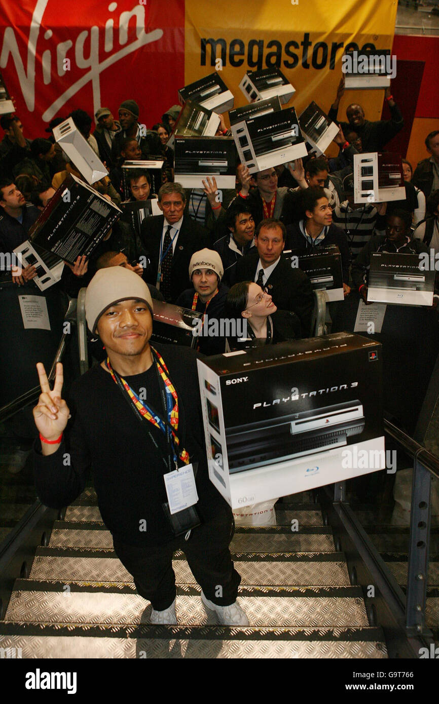 Ritatsu Thomas, 17, from Mitcham in south London, becomes the first customer in the UK to purchase a Sony Playstation 3 during the midnight UK launch at Virgin Megastore in Oxford Street, central London. Stock Photo