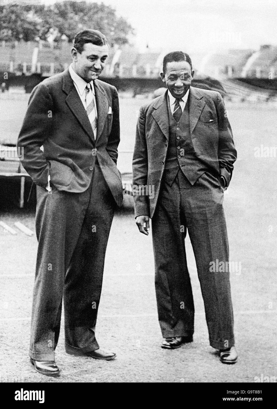 The two captains, England's Wally Hammond (l) and West Indies' Learie Constantine (r), inspect the pitch Stock Photo