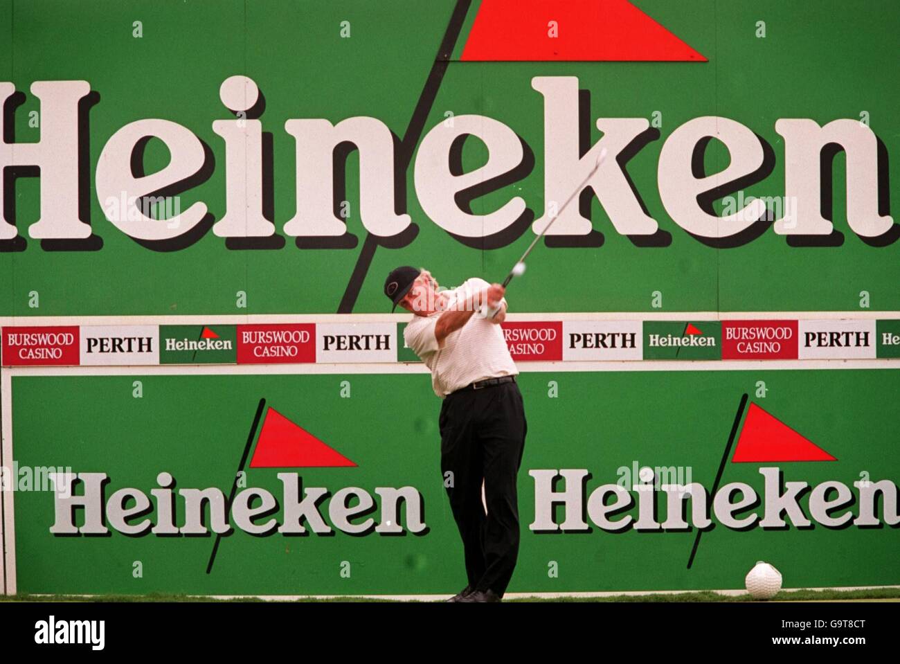 Golf, Heineken Classic. Greg Norman tees off Stock Photo Alamy